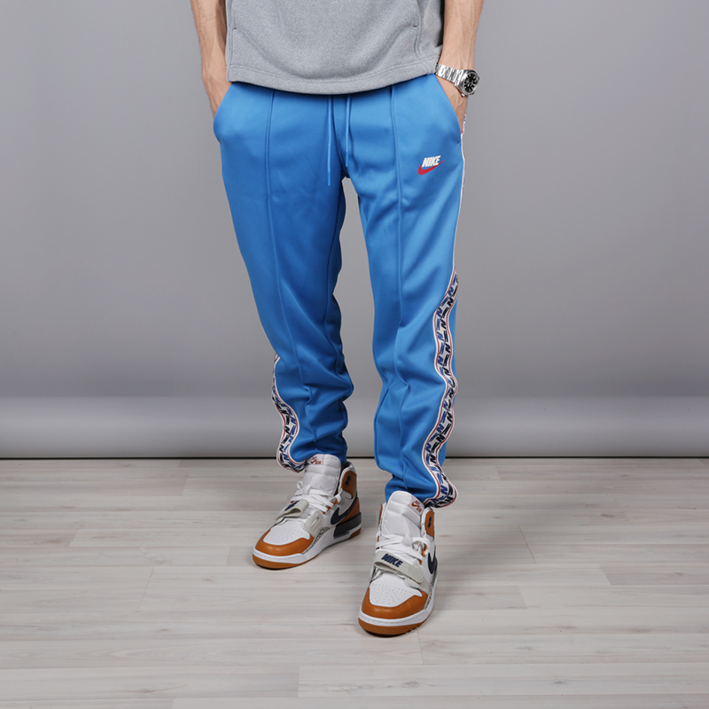 мужские голубые брюки Nike Taped Poly Pant AJ2297-465 - цена, описание, фото 1
