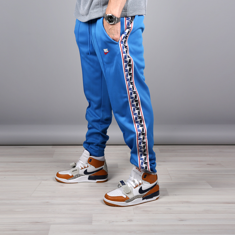 мужские голубые брюки Nike Taped Poly Pant AJ2297-465 - цена, описание, фото 2